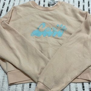 Levi’s cropped crewneck, peach with baby blue lettering